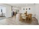 Cozy dining area featuring a wooden table with stylish chairs and modern decor, connecting to the kitchen at 7124 Turquoise Ln, Orlando, FL 32807
