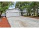 Charming home features a two-car garage and manicured landscaping, creating a welcoming curb appeal at 7124 Turquoise Ln, Orlando, FL 32807