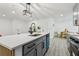 Bright modern kitchen featuring an island and stainless steel appliances at 7124 Turquoise Ln, Orlando, FL 32807