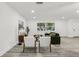 Bright living room with stylish decor, sleek floors, comfortable seating, and a large window at 7124 Turquoise Ln, Orlando, FL 32807