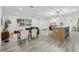 Bright and airy open-concept living space with a view of the kitchen, dining area, and comfortable seating at 7124 Turquoise Ln, Orlando, FL 32807