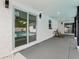 Covered patio boasts a sliding glass door with a view of the refreshing pool at 7124 Turquoise Ln, Orlando, FL 32807