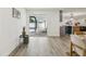 Indoor view of a sliding glass door leading to a patio with a pool, seamlessly connecting indoor and outdoor spaces at 7124 Turquoise Ln, Orlando, FL 32807