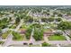 Overview of the neighborhood featuring a lovely house surrounded by lush greenery and beautiful landscaping at 7124 Turquoise Ln, Orlando, FL 32807