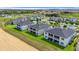 Discover modern townhomes featuring screened balconies overlooking well-maintained lawns and community amenities at 877 Ocean Course Ave, Davenport, FL 33896