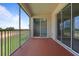 Relax on this condo's private screened balcony offering golf course views and sliding glass doors to the interior at 877 Ocean Course Ave, Davenport, FL 33896