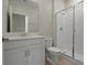 Bright bathroom featuring a glass-enclosed shower and neutral tiling at 877 Ocean Course Ave, Davenport, FL 33896