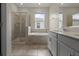 Beautiful bathroom featuring a tiled shower, tub, and double sink vanity at 877 Ocean Course Ave, Davenport, FL 33896