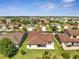 Aerial view of the home highlighting the spacious backyard and the property's location within the community at 921 Costa Mesa Ln, Kissimmee, FL 34744