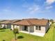 Aerial view of home's backyard with covered patio at 921 Costa Mesa Ln, Kissimmee, FL 34744