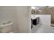 Tiled bathroom features a sleek vanity and a walk-in shower, offering a clean, modern space at 921 Costa Mesa Ln, Kissimmee, FL 34744