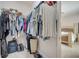 Walk-in closet provides ample storage with shelving and hanging space, adjacent to the main bedroom at 921 Costa Mesa Ln, Kissimmee, FL 34744