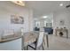 Open concept dining area flows to living room with neutral-toned decor at 921 Costa Mesa Ln, Kissimmee, FL 34744