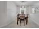 Dining room features a dining table set with contemporary pendant lighting at 921 Costa Mesa Ln, Kissimmee, FL 34744
