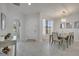 Open-concept design connecting the dining area to the entry and other living spaces at 921 Costa Mesa Ln, Kissimmee, FL 34744