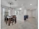 Dining room with a table and decorative chandelier and open layout at 921 Costa Mesa Ln, Kissimmee, FL 34744