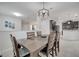 A dining room with stylish lighting fixtures overlooking kitchen area at 921 Costa Mesa Ln, Kissimmee, FL 34744