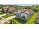 Beautiful exterior of the home with a well-manicured lawn, landscaped garden, and a two-car garage at 921 Costa Mesa Ln, Kissimmee, FL 34744
