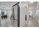 Modern kitchen featuring stainless steel refrigerator and dining area at 921 Costa Mesa Ln, Kissimmee, FL 34744