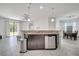 Open concept with granite island featuring a stainless steel dishwasher at 921 Costa Mesa Ln, Kissimmee, FL 34744