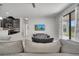 Open concept living room and kitchen with TV and view to the backyard at 921 Costa Mesa Ln, Kissimmee, FL 34744