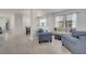 Open-concept living area with neutral tones and ample natural light at 921 Costa Mesa Ln, Kissimmee, FL 34744