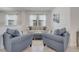 Cozy living space with matching sofas, neutral walls and window with lots of light at 921 Costa Mesa Ln, Kissimmee, FL 34744