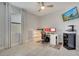 Bright office space with natural light, offering a functional area for work or study with a modern TV at 921 Costa Mesa Ln, Kissimmee, FL 34744
