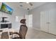 Bright office space features tile floors, a ceiling fan, a wall-mounted TV, and a white board at 921 Costa Mesa Ln, Kissimmee, FL 34744