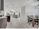 Open floor plan connecting the dining area to the living space at 921 Costa Mesa Ln, Kissimmee, FL 34744