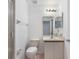 This bathroom features tile floors, a shower, toilet and a vanity with mirror at 10438 Sw 85Th Ct, Ocala, FL 34481