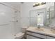Bathroom with shower, tile floors, toilet and vanity with large mirror at 10438 Sw 85Th Ct, Ocala, FL 34481