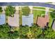 Aerial view showing property lines, surrounding homes, landscaping, and nearby roads at 1124 Hidden Blf, Clermont, FL 34711
