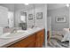 Bright bathroom featuring double sinks, vanity with storage, and coordinated decor at 1124 Hidden Blf, Clermont, FL 34711