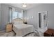 Comfortable bedroom with neutral decor, ceiling fan, and en-suite bathroom at 1124 Hidden Blf, Clermont, FL 34711