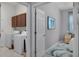 Convenient laundry area located near a bedroom, with modern appliances and tile flooring at 1124 Hidden Blf, Clermont, FL 34711