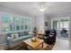 Comfortable living room with natural light and plantation shutters, offering a serene atmosphere at 1124 Hidden Blf, Clermont, FL 34711