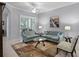 Bright and inviting living room with neutral tones, plush seating, and ample natural light at 1124 Hidden Blf, Clermont, FL 34711