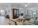Spacious open-concept living area with elegant furnishings and seamless flow between rooms at 1124 Hidden Blf, Clermont, FL 34711