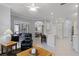 Open-concept living space combining the kitchen, living, and dining areas for modern living at 1124 Hidden Blf, Clermont, FL 34711