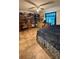 Bedroom with decorative accents, a large window, and neutral-toned flooring at 11582 Westwood Blvd # 1428, Orlando, FL 32821