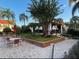 Outdoor patio featuring a pergola, greenery, brick accents, and seating arrangements at 11582 Westwood Blvd # 1428, Orlando, FL 32821
