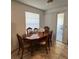 Dining room featuring a wood dining table and chairs underneath a fixture at 11582 Westwood Blvd # 1428, Orlando, FL 32821