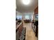 Functional kitchen with wood cabinets, granite countertops, and adjacent dining area at 11582 Westwood Blvd # 1428, Orlando, FL 32821