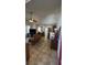 Bright living room with tile flooring, ample natural light, and views into the kitchen and dining area at 11582 Westwood Blvd # 1428, Orlando, FL 32821