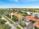 Aerial view of the community, clubhouse, and lake at 11937 Bianca Ln, Orlando, FL 32827