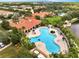 Aerial view of community clubhouse and pool, surrounded by lush landscaping at 11937 Bianca Ln, Orlando, FL 32827