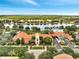 Aerial view of the clubhouse and pool overlooking a lake at 11937 Bianca Ln, Orlando, FL 32827