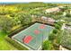 Outdoor basketball court featuring green surface with red keys, complete with lighting for evening play at 11937 Bianca Ln, Orlando, FL 32827