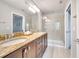 Beautiful bathroom featuring a double vanity, granite countertops, and a walk-in shower at 11937 Bianca Ln, Orlando, FL 32827